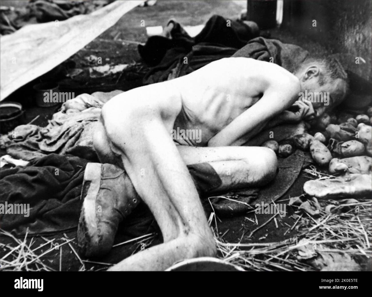 Body of a prisoner at the Dachau Nazi concentration camp, opened on 22 March 1933, which was initially intended to hold political prisoners. Dachau is in Bavaria. After its opening by Heinrich Himmler, it held Jews, Romani, German and Austrian criminals. It was liberated by U.S. forces on 29 April 1945. Stock Photo