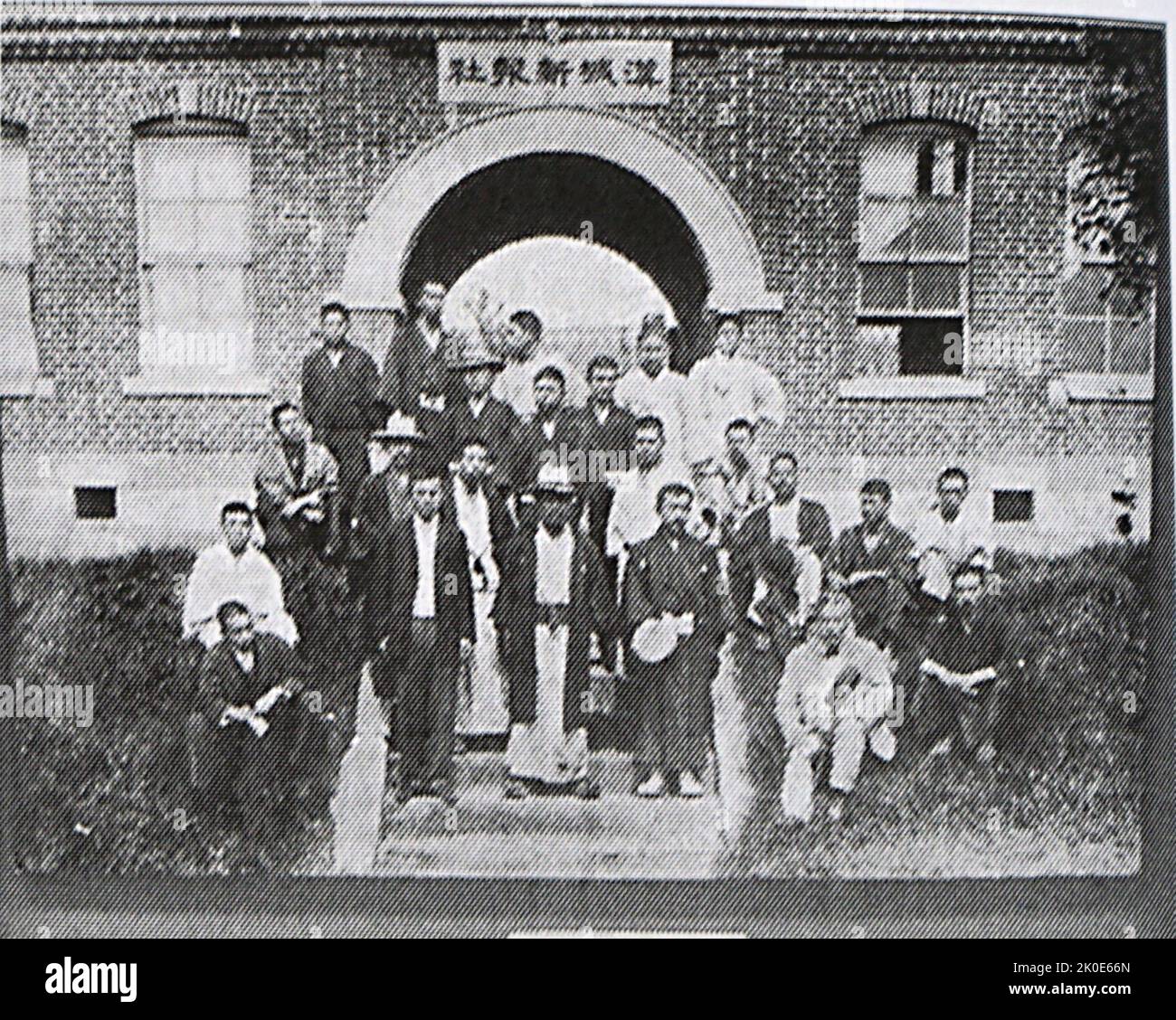 Alleged killers (ronin) of Queen Min posing in front of Hanseong sinbo building in Seoul (1895). Empress Myeongseong or Empress Myung-Sung (1851 - 1895), known informally as Queen Min. On 8 October 1895, the Hullyeondae Regiment, loyal to the Daewongun, attacked the Gyeongbokgung, overpowering its Royal Guards. Hullyeondae officers, led by Major Woo Beomseon, then allowed a group of former samurai to infiltrate and assassinate the Empress. Stock Photo