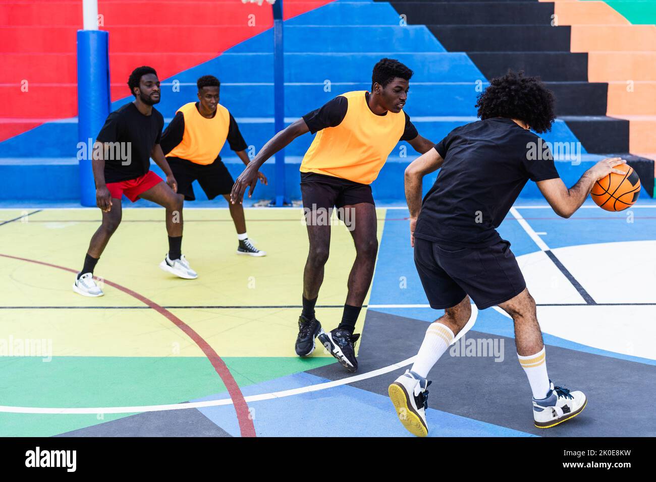Young African friends playing basketball outdoor - Urban sport lifestyle concept Stock Photo