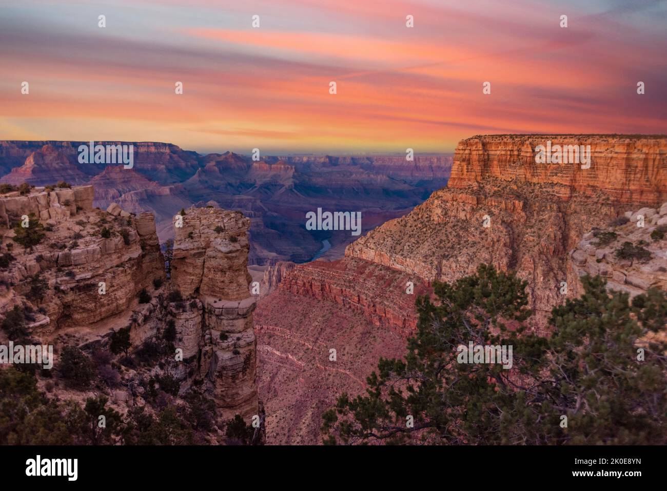 A view of the rugged yet beautiful and dramatic Grand Canyon national park during a moody sunset shows the intricate details of the ridges and formati Stock Photo