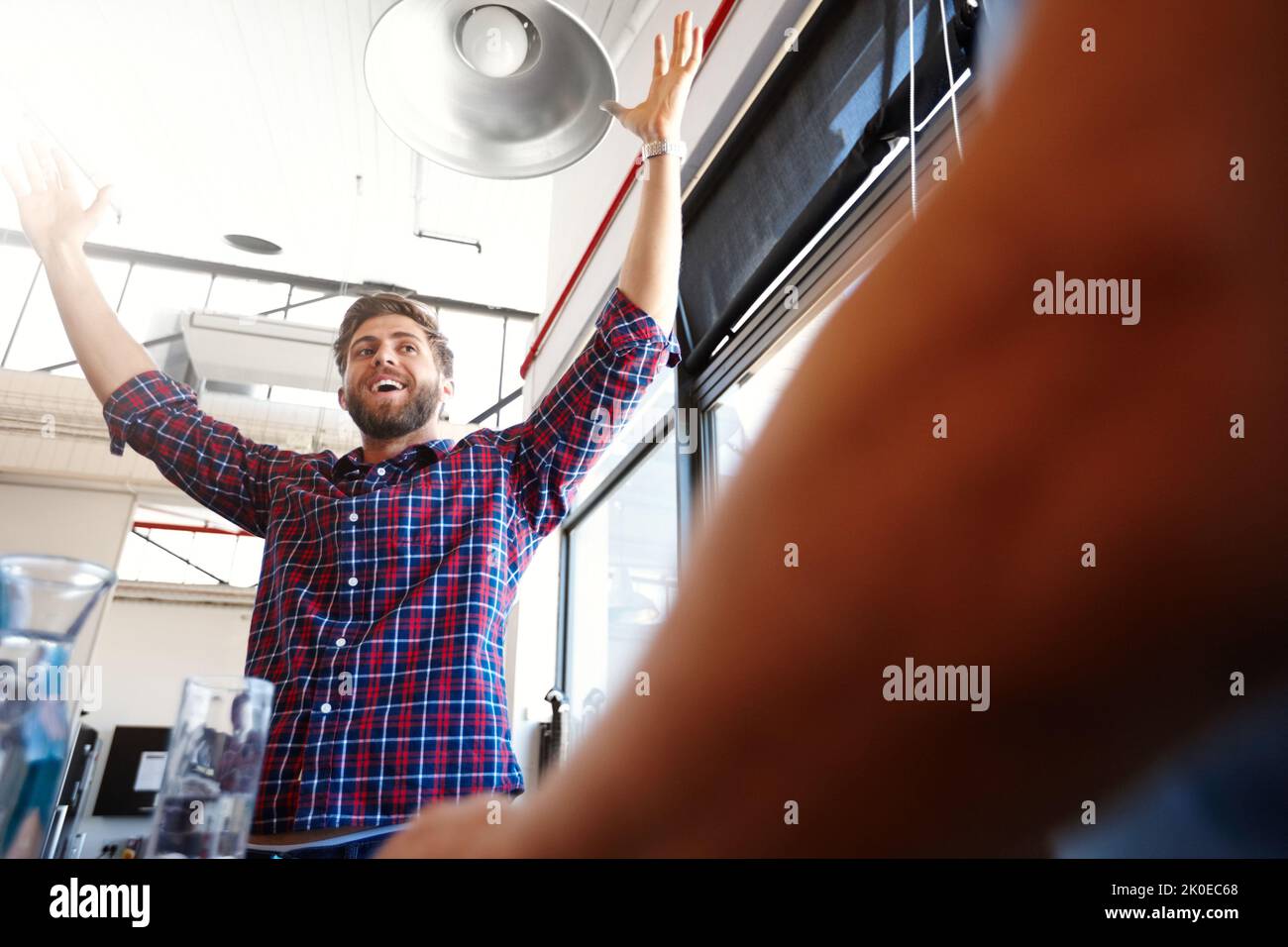 Success is the best revenge. a man raising his arms in victory at the ...