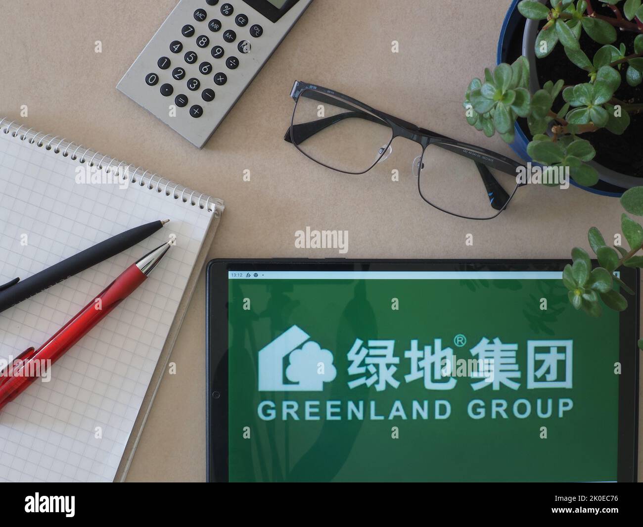 In this photo illustration, Greenland Holdings Corp., Ltd. known as Greenland Group, logo seen displayed on a tablet Stock Photo