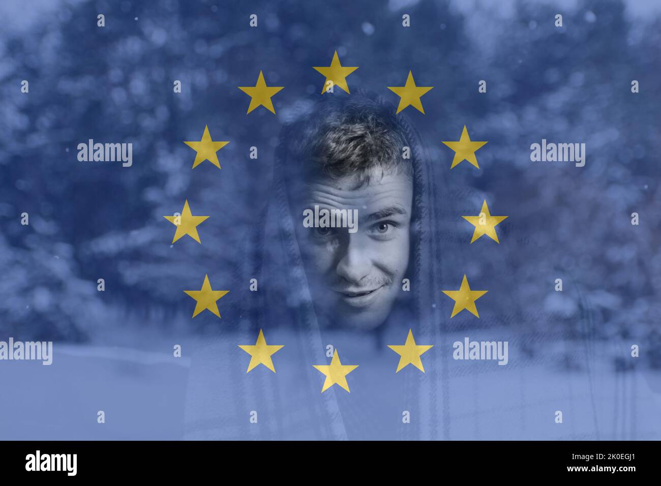 Defocus man wearing blanket. Flag European Union. Increase in the cost