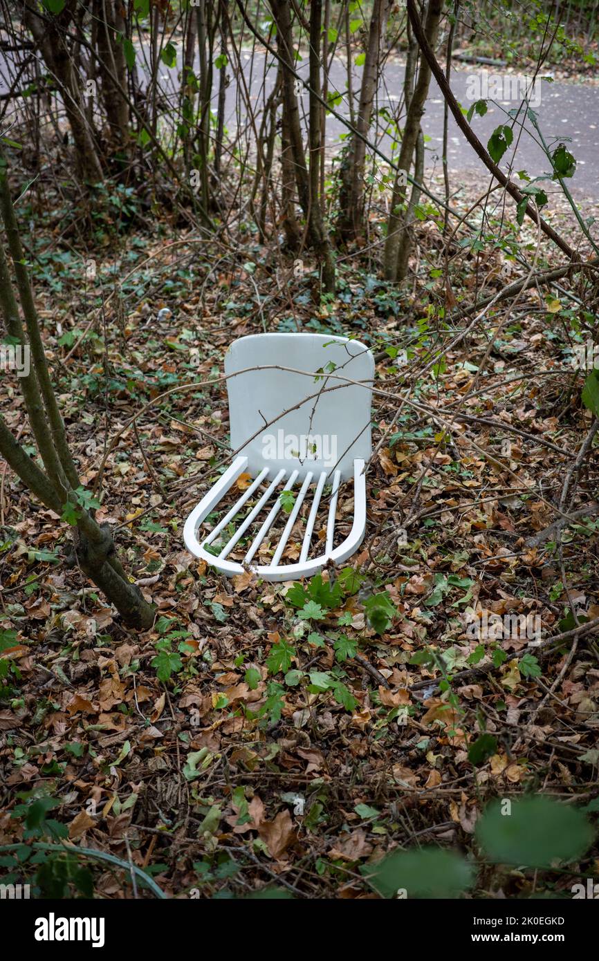 Abandoned white wooden dining chair (Aug22) Stock Photo