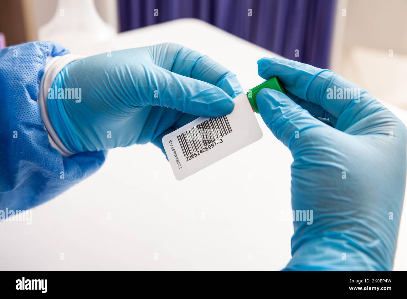 Closeup of a nurse labelling a test tube with blood sample in a clinical laboratory Stock Photo
