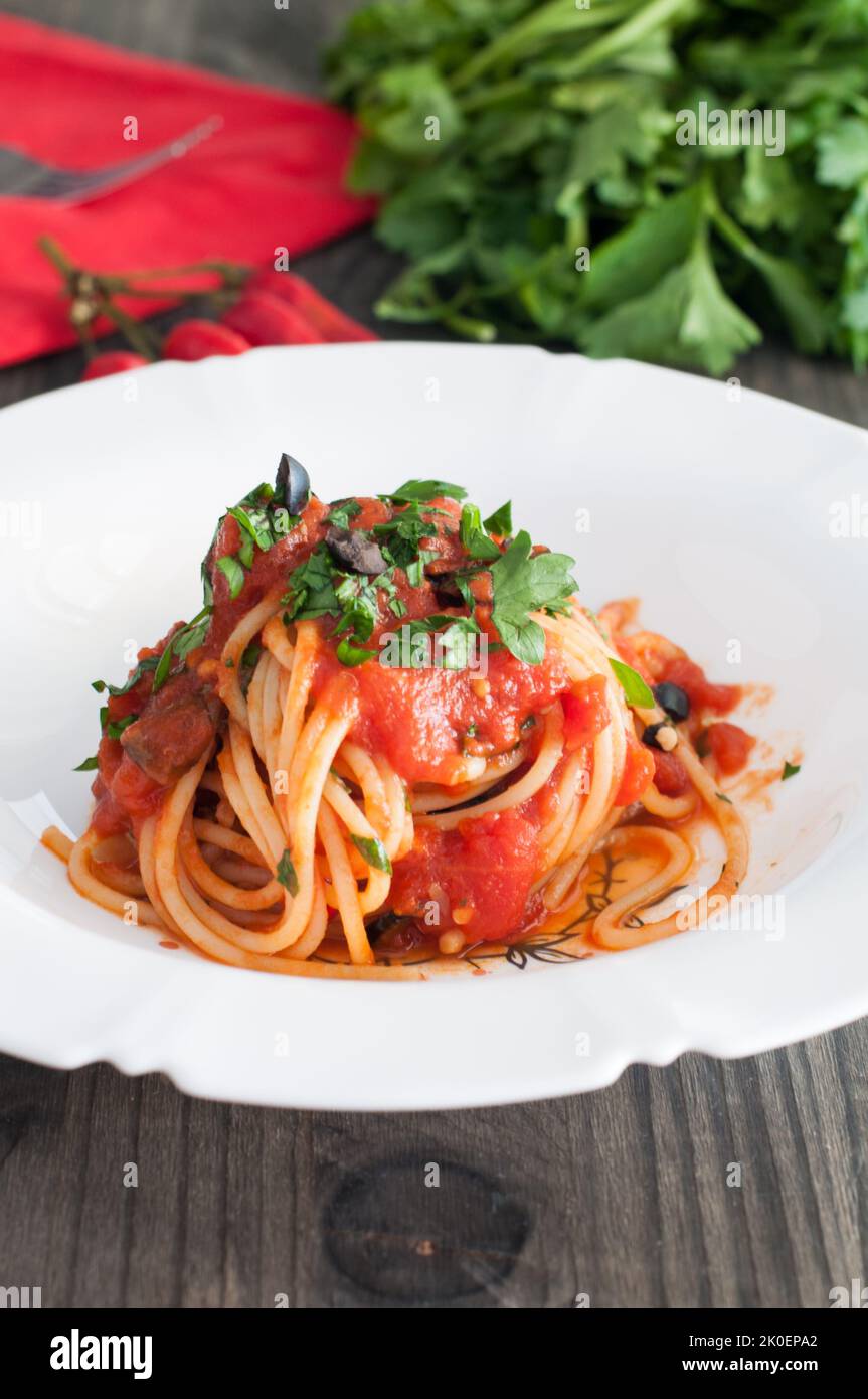 Spaghetti alla puttanesca, typical Italian recipe Stock Photo