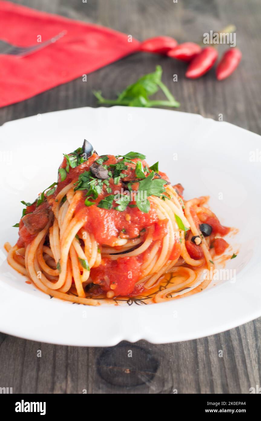 Spaghetti alla puttanesca, typical Italian recipe Stock Photo
