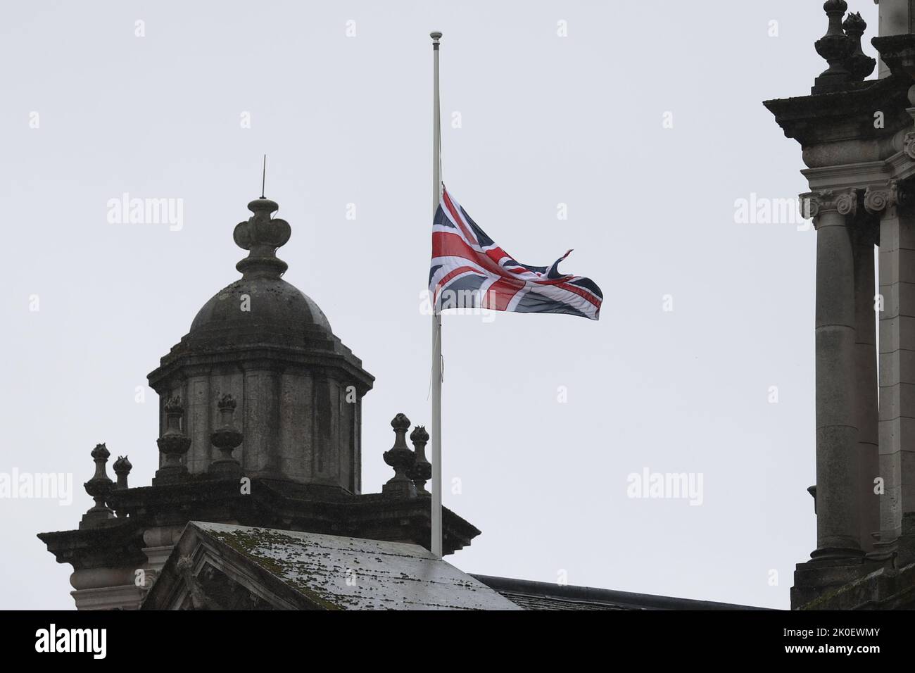 The Union flag flies at half mast above Belfast City Hall following the