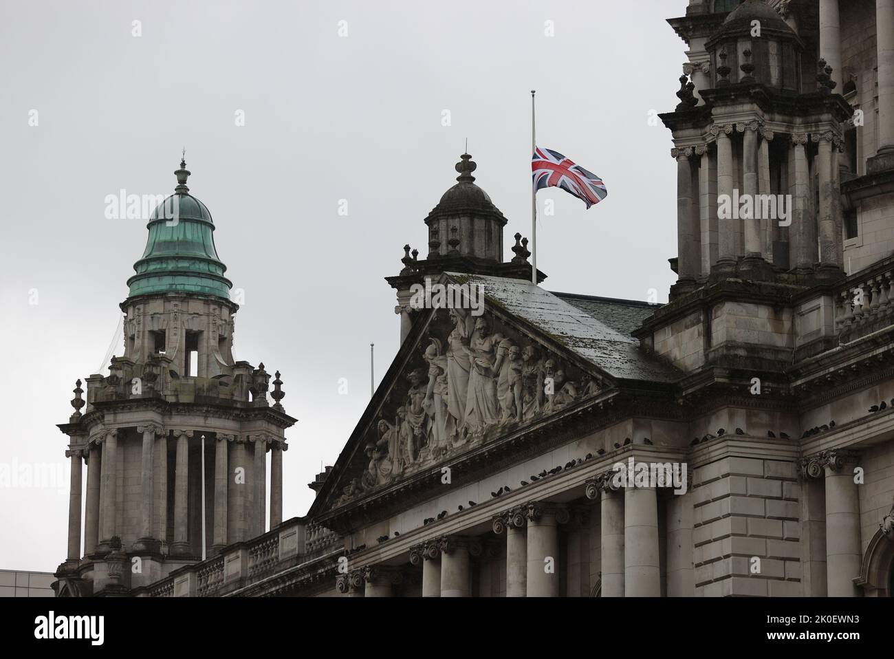 The Union flag flies at half mast above Belfast City Hall following the