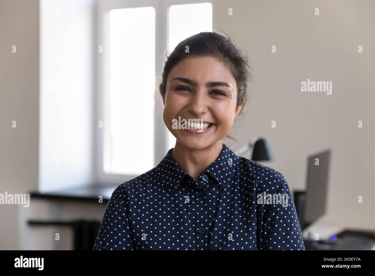 Happy beautiful young Indian office employee woman head shot portrait Stock Photo
