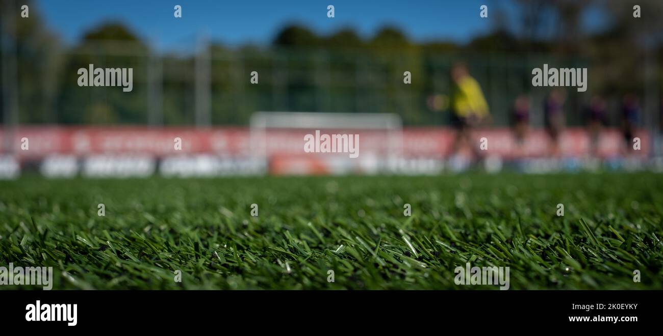 Football background with green grass space for copy and out of focus anonymous teams lined up in the back. Soccer tournament banner background. Stock Photo