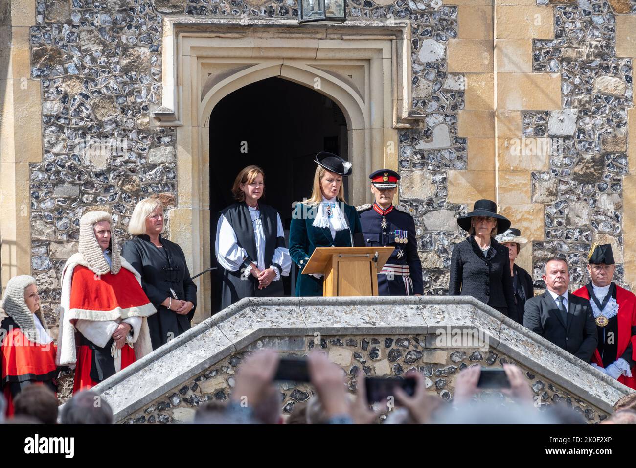 Winchester, Hampshire, UK. 11th September, 2022. The Proclamation of the Accession of King Charles III three days after the death of Queen Elizabeth II. The High Sheriff of Hampshire, Lady Edwina Grosvenor, accompanied by the Lord Lieutenant of Hampshire and other dignitaries, read the proclamation at 1pm outside The Great Hall in front of crowds of people. Stock Photo