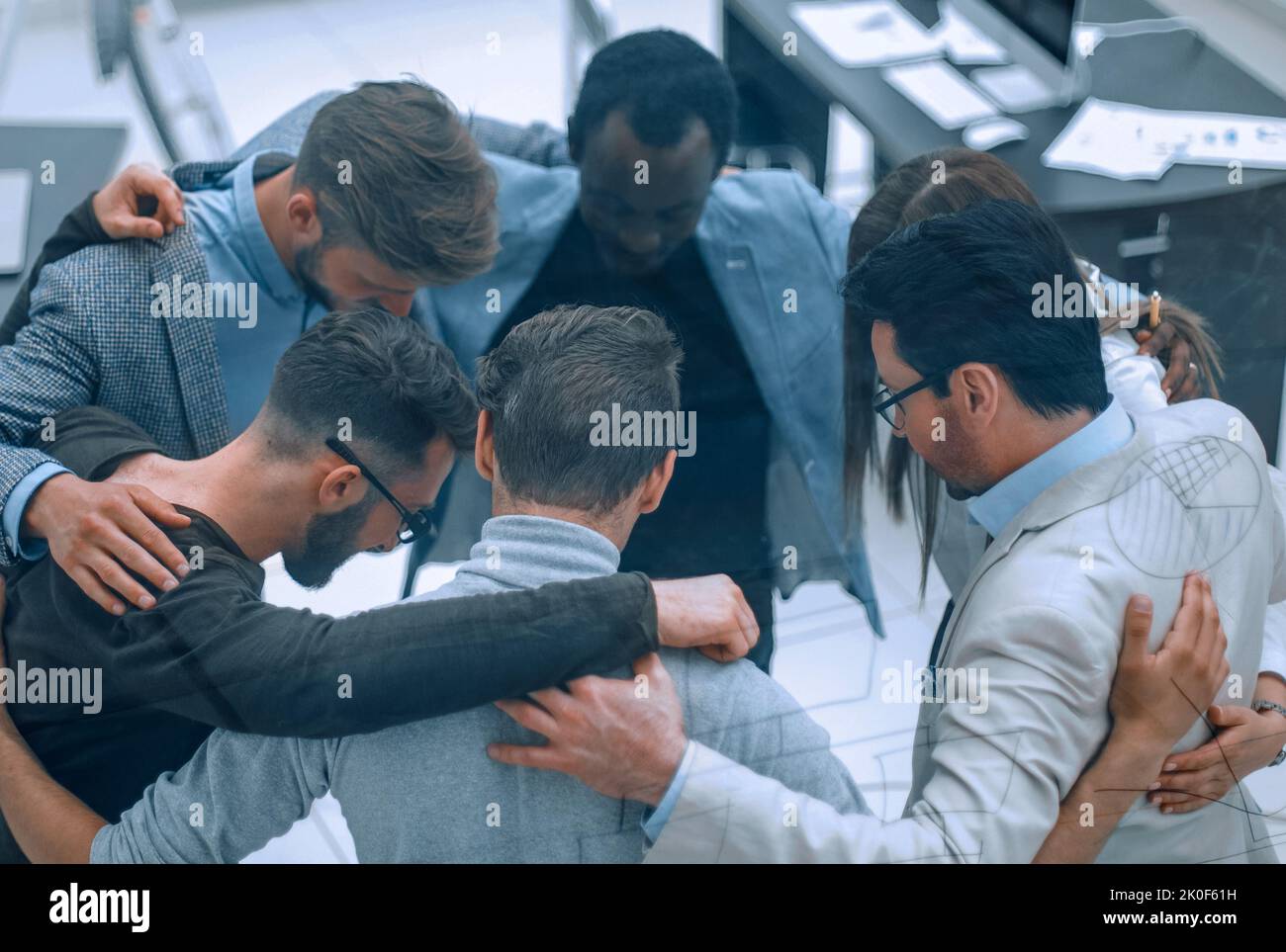 group of successful business people hugging each other Stock Photo - Alamy