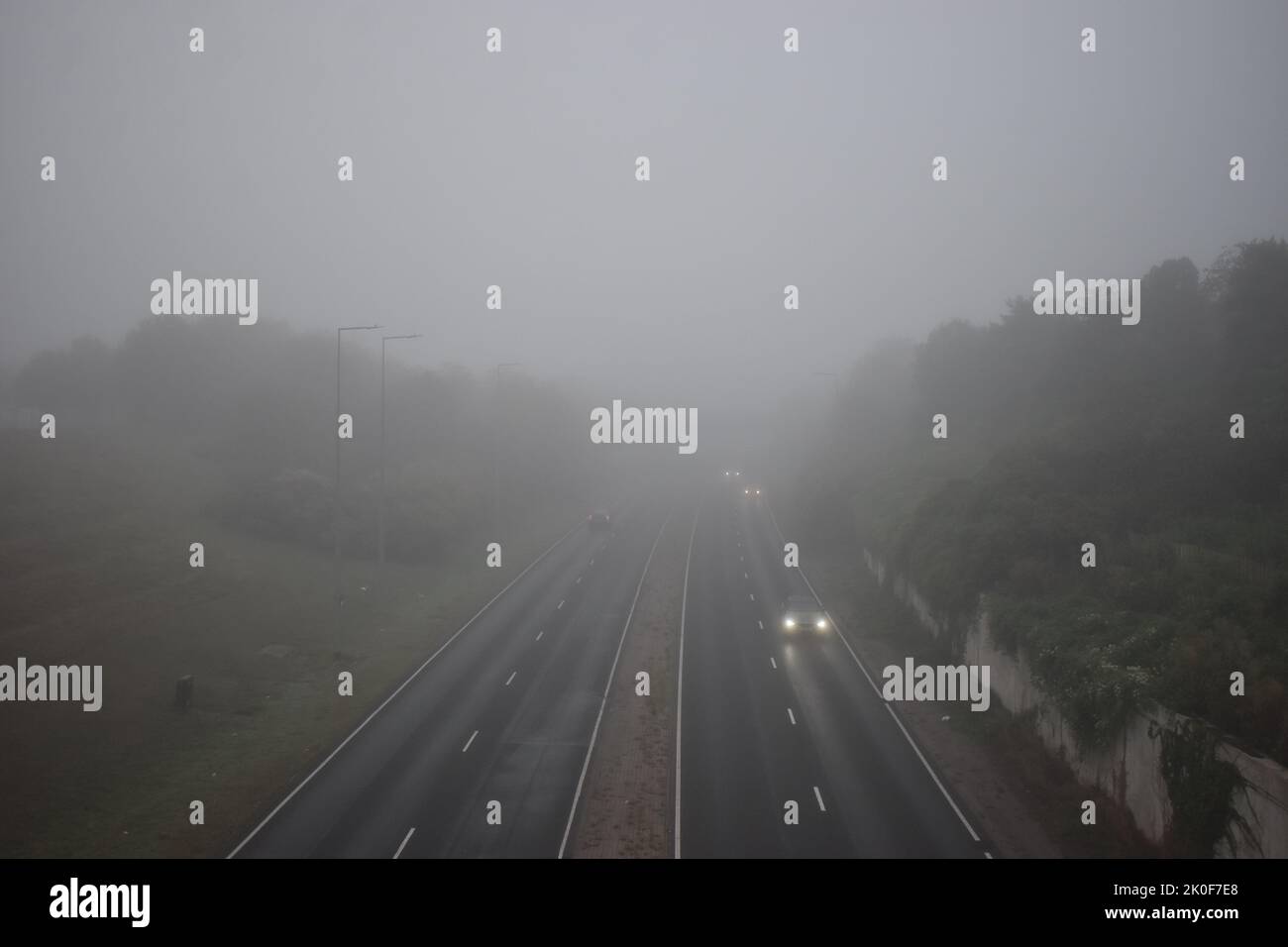 Dual carriageway on the B4034, V8 Marlborough Street in Milton Keynes on a foggy day. Stock Photo