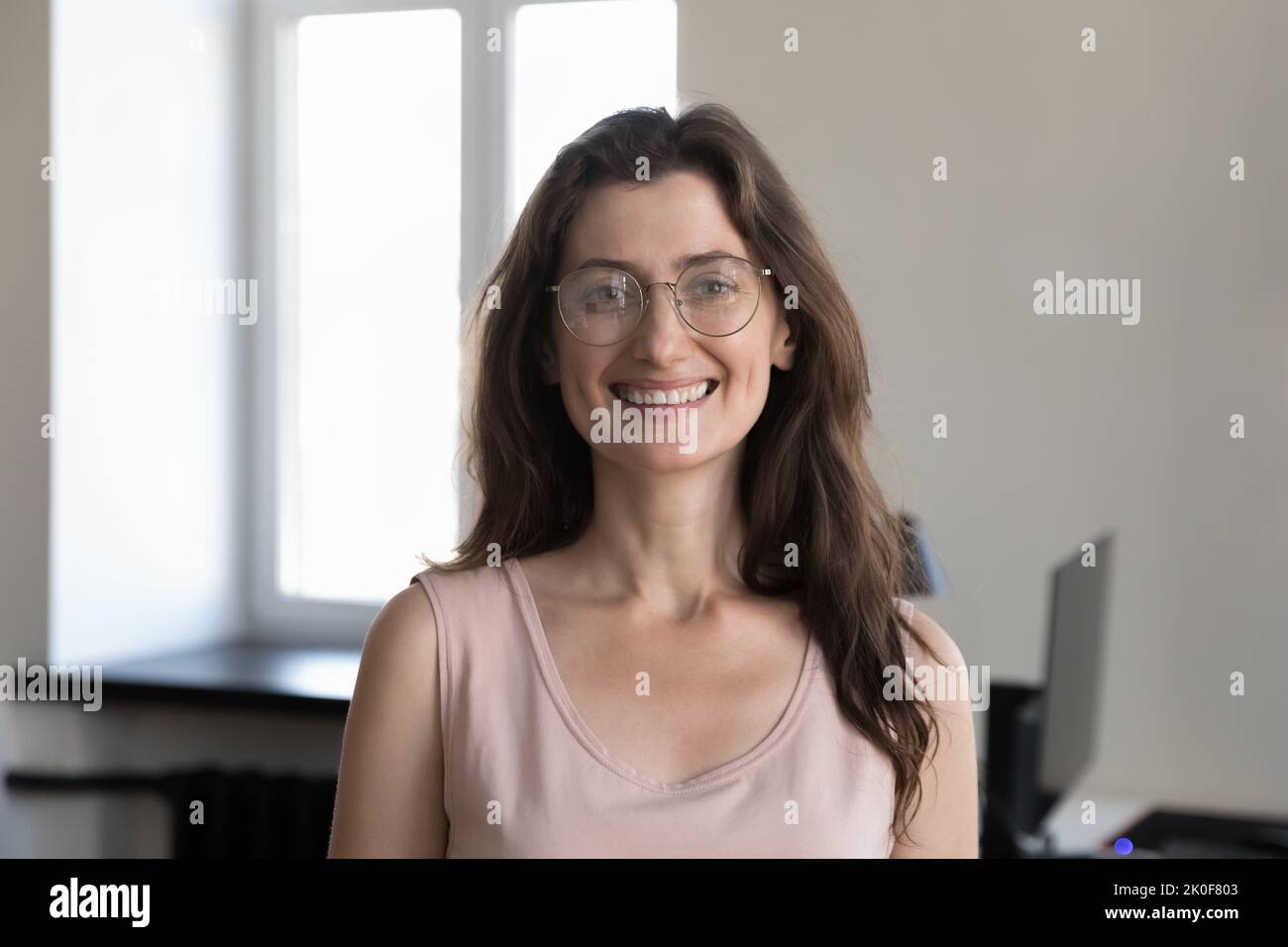 Happy pretty young business professional woman in glasses head shot Stock Photo