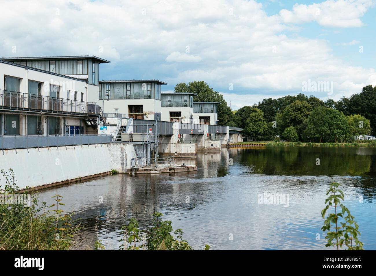 Weir with 3,3 MW hydroelectric power station on the Weser river in Petershagen, Germany Stock Photo