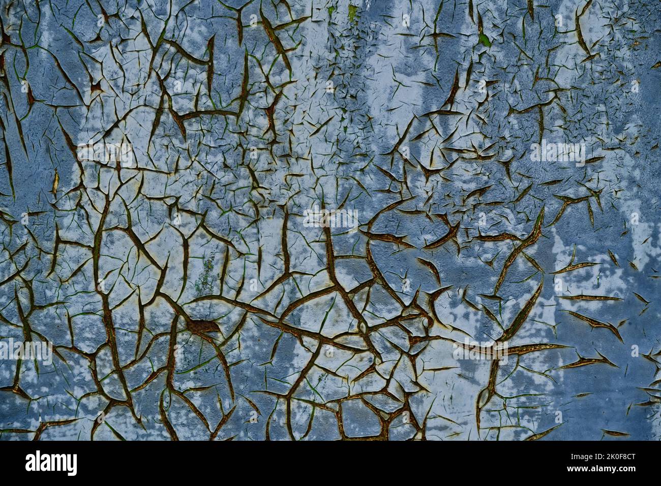 Old cracked blue paint on rusty metal surface Stock Photo