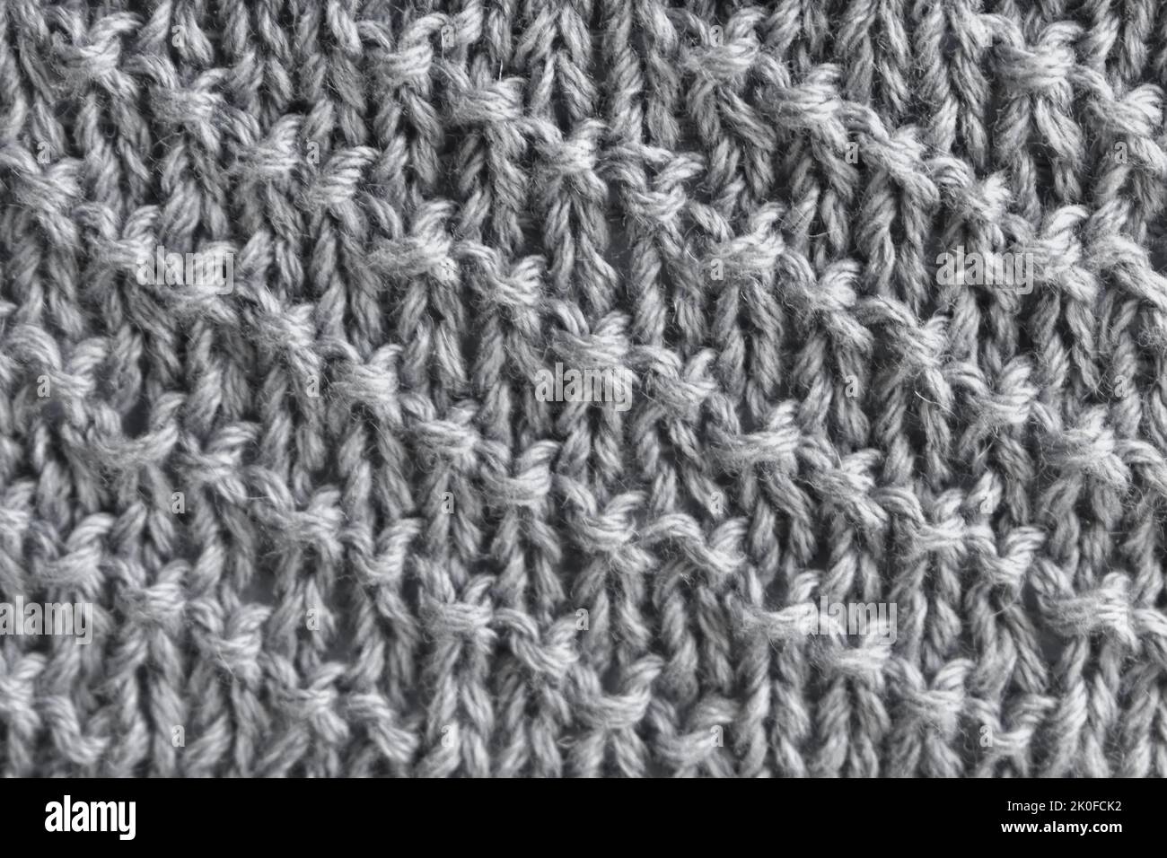 Gray wool jersey with diagonal stripes. Clothes background. Stock Photo