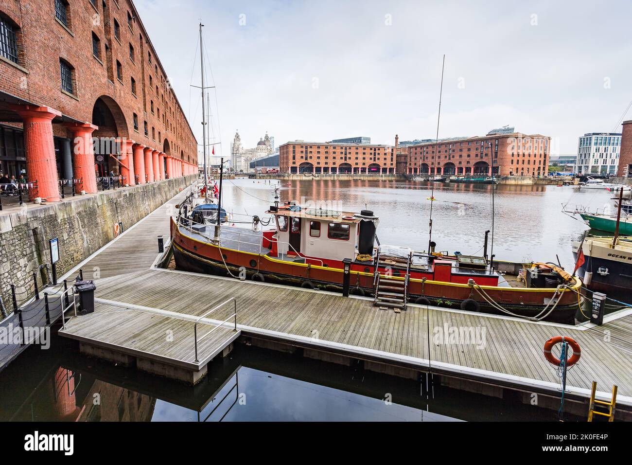 Boats moored around the edge of the the Royal Albert Dock on the Liverpool waterfront seen in September 2022. Stock Photo