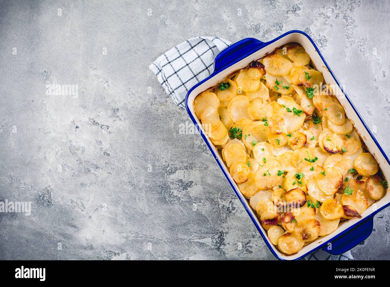 Potato casserole with onions and eggs. Vegetarian meal. Stock Photo
