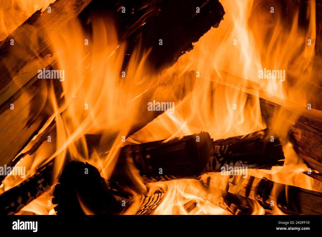 Fire with flame is burning in the wood-fired pizza oven Stock Photo