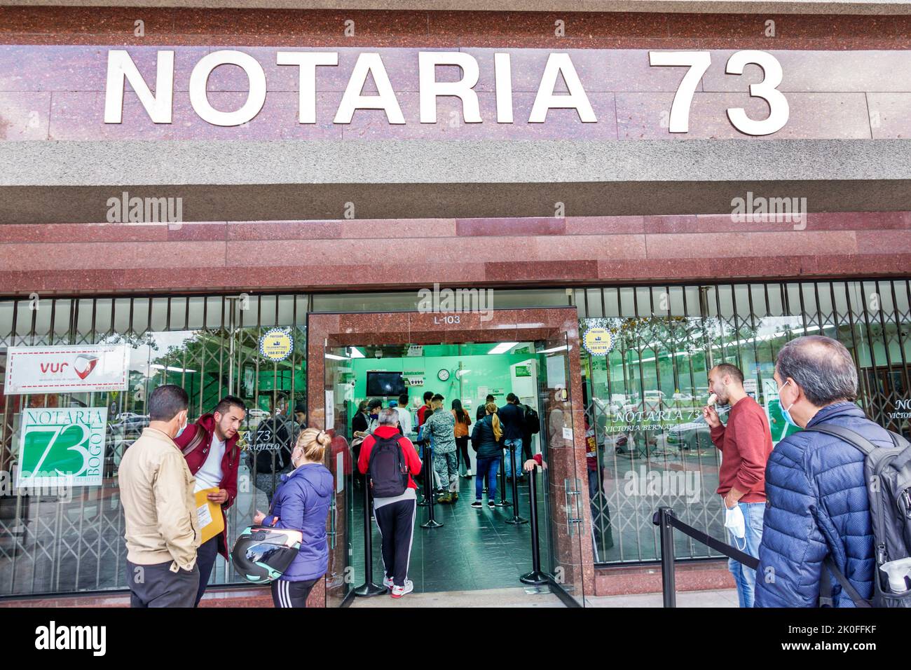 Bogota Colombia,Avenida El Dorado Calle 26,Notaria 73 notary public office outside exterior front entrance,man men male woman women female,Colombian C Stock Photo