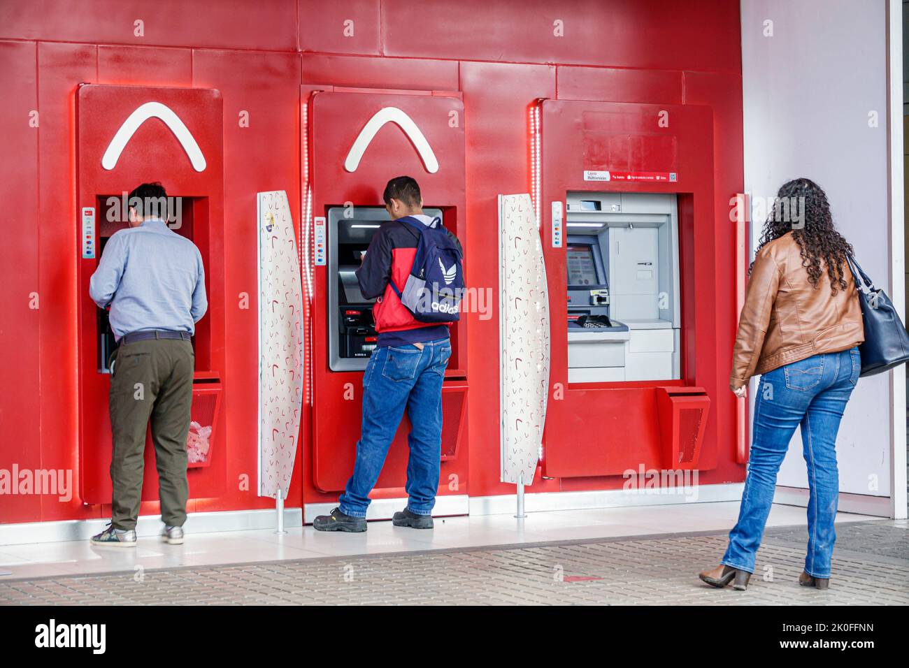 Bogota Colombia,Avenida El Dorado Calle 26,Davivienda Colombian bank ATM automated teller,man men male woman women female,Colombian Colombians Hispani Stock Photo