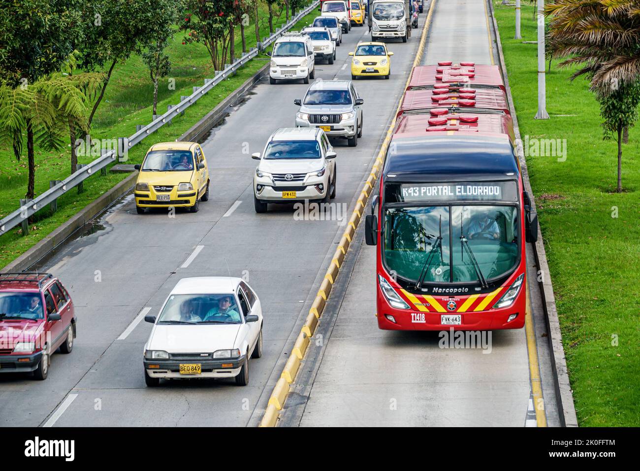 Bogota Colombia,Avenida El Dorado Calle 26,TransMilenio bus rapid transit system BRT public transportation restricted reserved lane traffic,Colombian Stock Photo