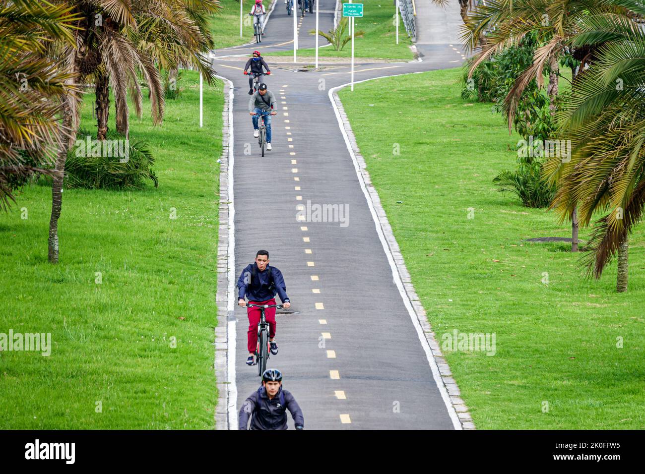 Bogota Colombia,Avenida El Dorado Calle 26,protected segregated bicycle lane cycling network bikeway Ciclovia,man men male,Colombian Colombians Hispan Stock Photo