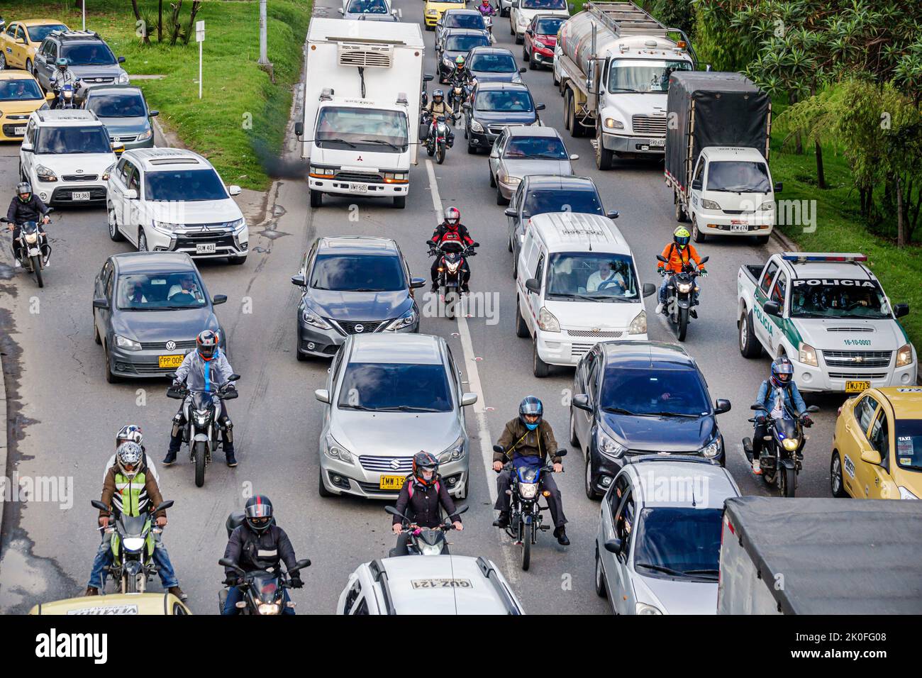 Bogota Colombia,Avenida El Dorado Calle 26,bottleneck merging traffic rush hour cars trucks lorries vehicles,Colombian Colombians Hispanic Hispanics S Stock Photo