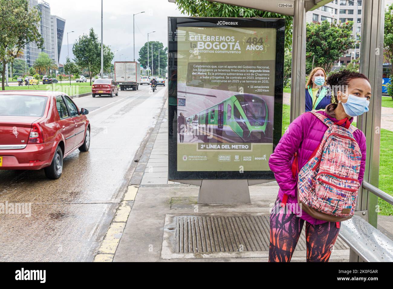 Bogota Colombia,Avenida El Dorado Calle 26,bus-stop advertising billboard sign rapid transit Metro project,woman women female looking,Colombian Colomb Stock Photo