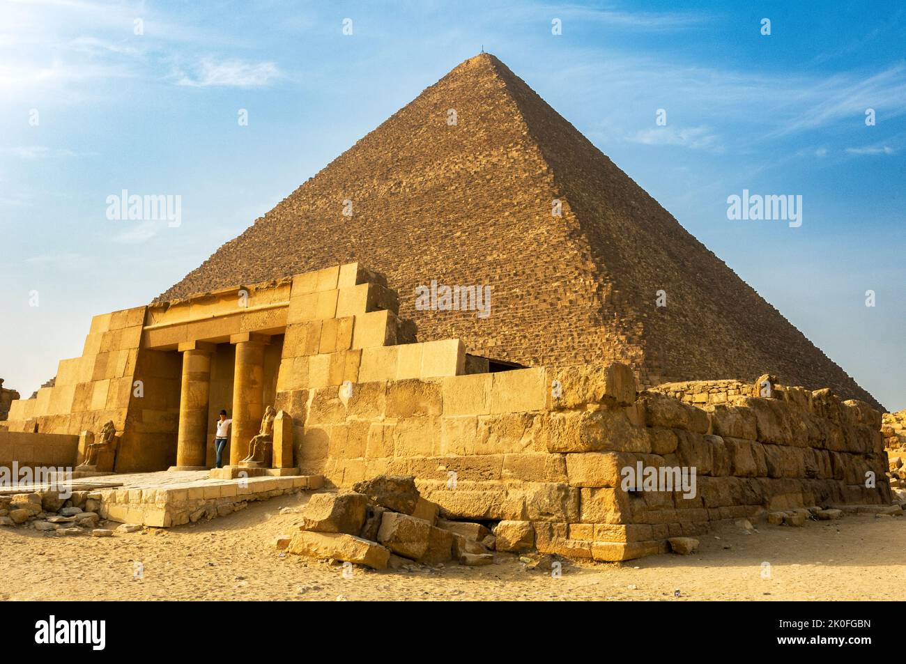The restored entrance to the mastaba of Seshemnefer IV with the pyramid of Khufu behind, Giza pyramid complex, Cairo, Egypt Stock Photo
