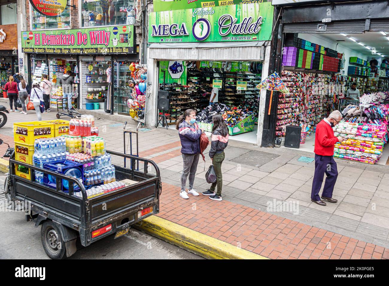 Bogota Colombia,riding Transmilenio bus route A206,Carrera 10,store stores business businesses shop shops market markets marketplace selling buying sh Stock Photo
