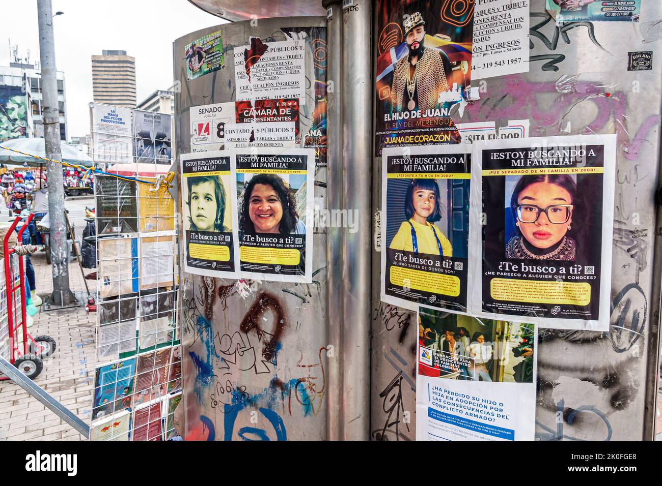 Bogota Colombia,San Victorino Avenida Carrera 10 flyposting advertising wheat paste posters family reunification campaign illegal adoption victims hum Stock Photo