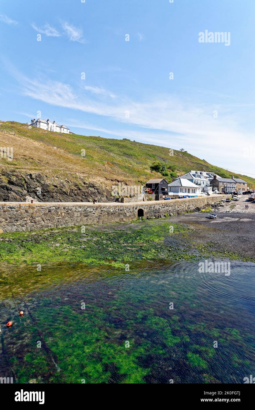 Historic harbour at Mullion Cove in Mounts Bay Cornwall England United Kingdom. 13th of August 2022. Mullion Cove or Porth Mellin is a small port on t Stock Photo