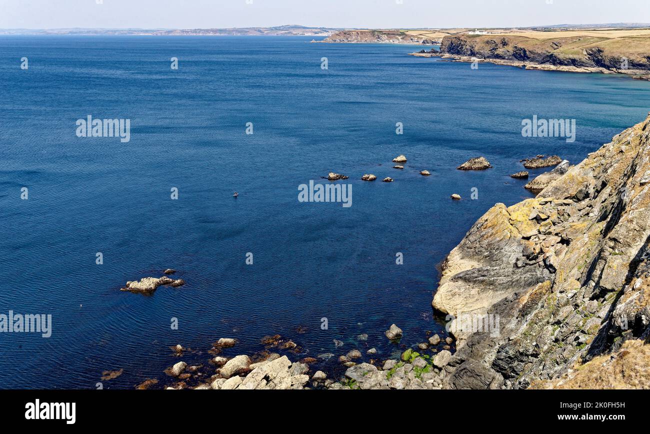 Historic harbour at Mullion Cove in Mounts Bay Cornwall England United Kingdom. 13th of August 2022. Mullion Cove or Porth Mellin is a small port on t Stock Photo