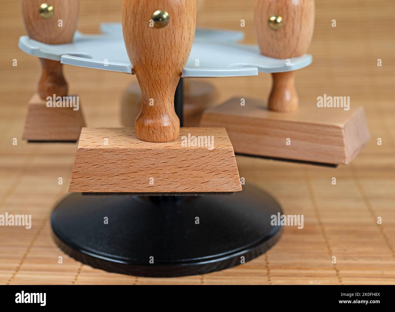 Various wooden stamps in stamp holders Stock Photo Alamy