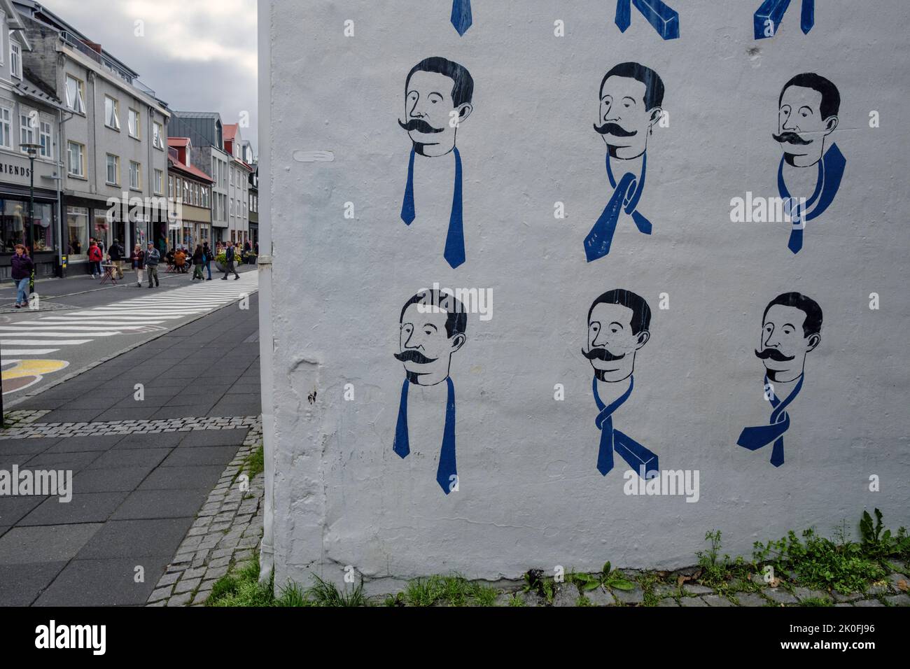 Mural on the side of a clothes shop showing how to tie a necktie, Reykjavik, Iceland Stock Photo