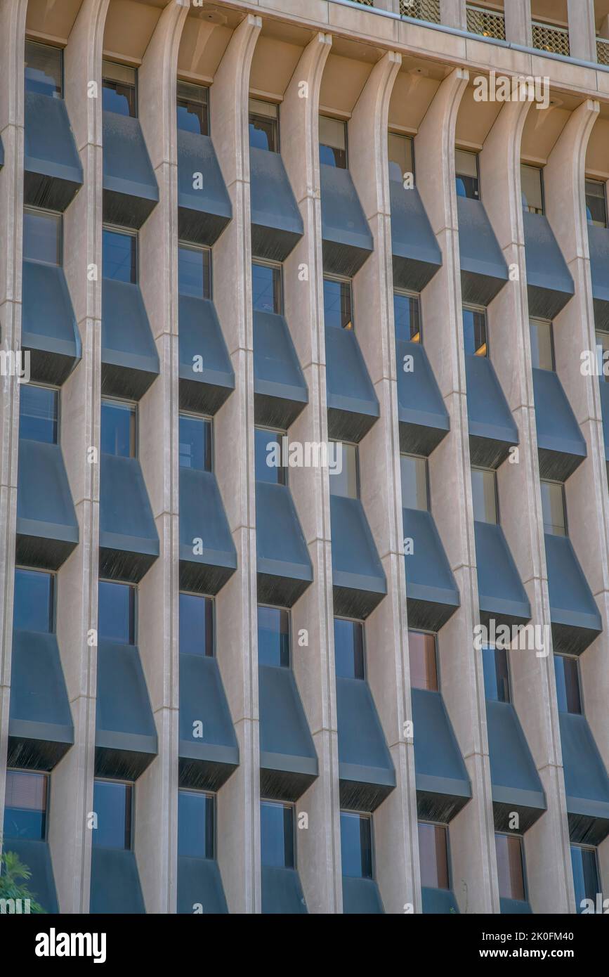 Panels Inbetween Windows Building exterior with curved wall panels in between the windows in ...
