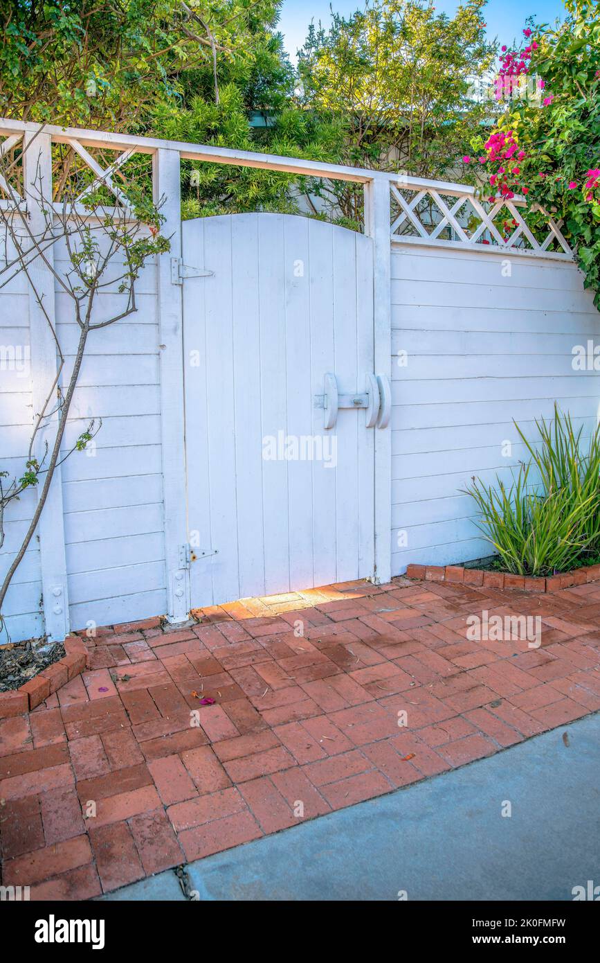 La Jolla, California Painted white wooden gate and fence. Entrance