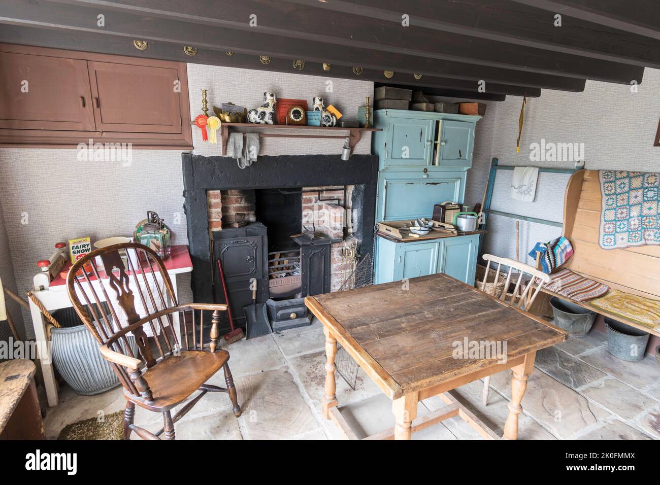 The kitchen of a farmhouse from Spain's Field Farm as it would have looked in the 1950s, Beamish Museum, England UK. Stock Photo