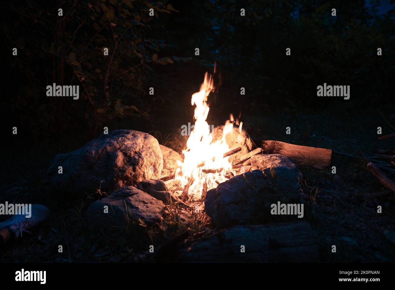 The flame of a bright fire burning at night in the camp, at night Stock Photo