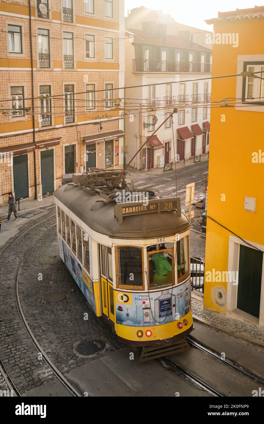 Old tram on the cobbled street in Lisbon, Portugal Stock Photo