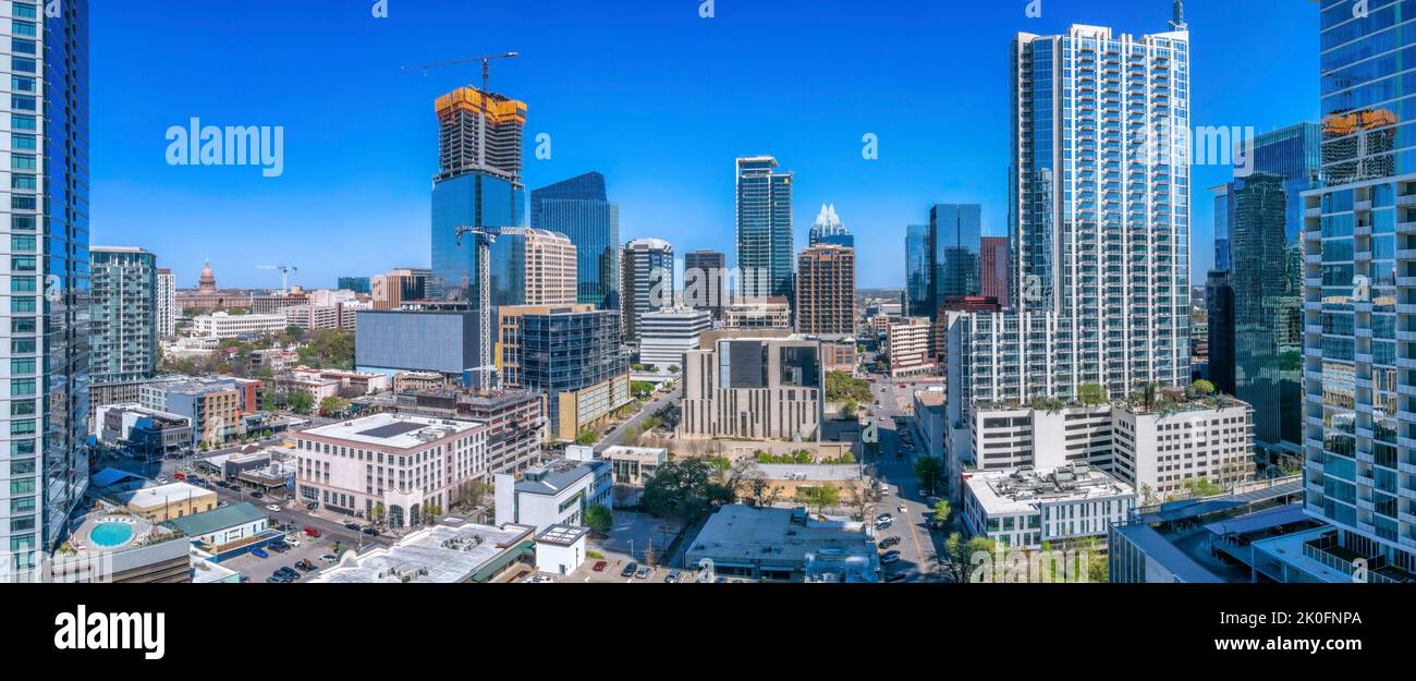 Austin, Texas cityscape against the clear blue sky. Modern corporate and residential buildings with vehicles on the road in between in a high angle vi Stock Photo