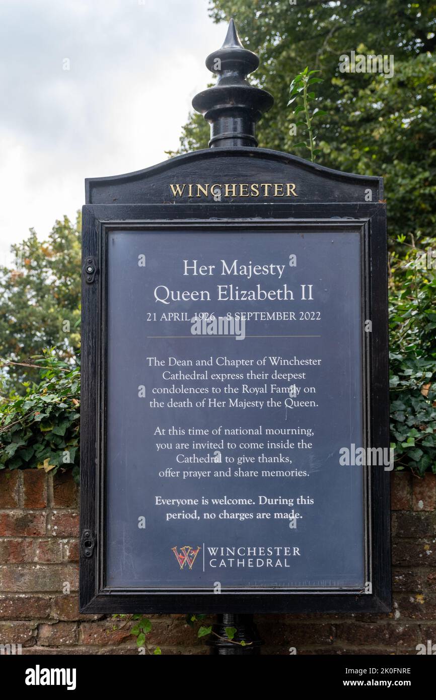 September 2022. Notice about the death of Queen Elizabeth II in the grounds of Winchester Cathedral, Hampshire, England, UK. An invitation to come inside the cathedral and give thanks, offer prayers and share memories during this time of national mourning. Stock Photo