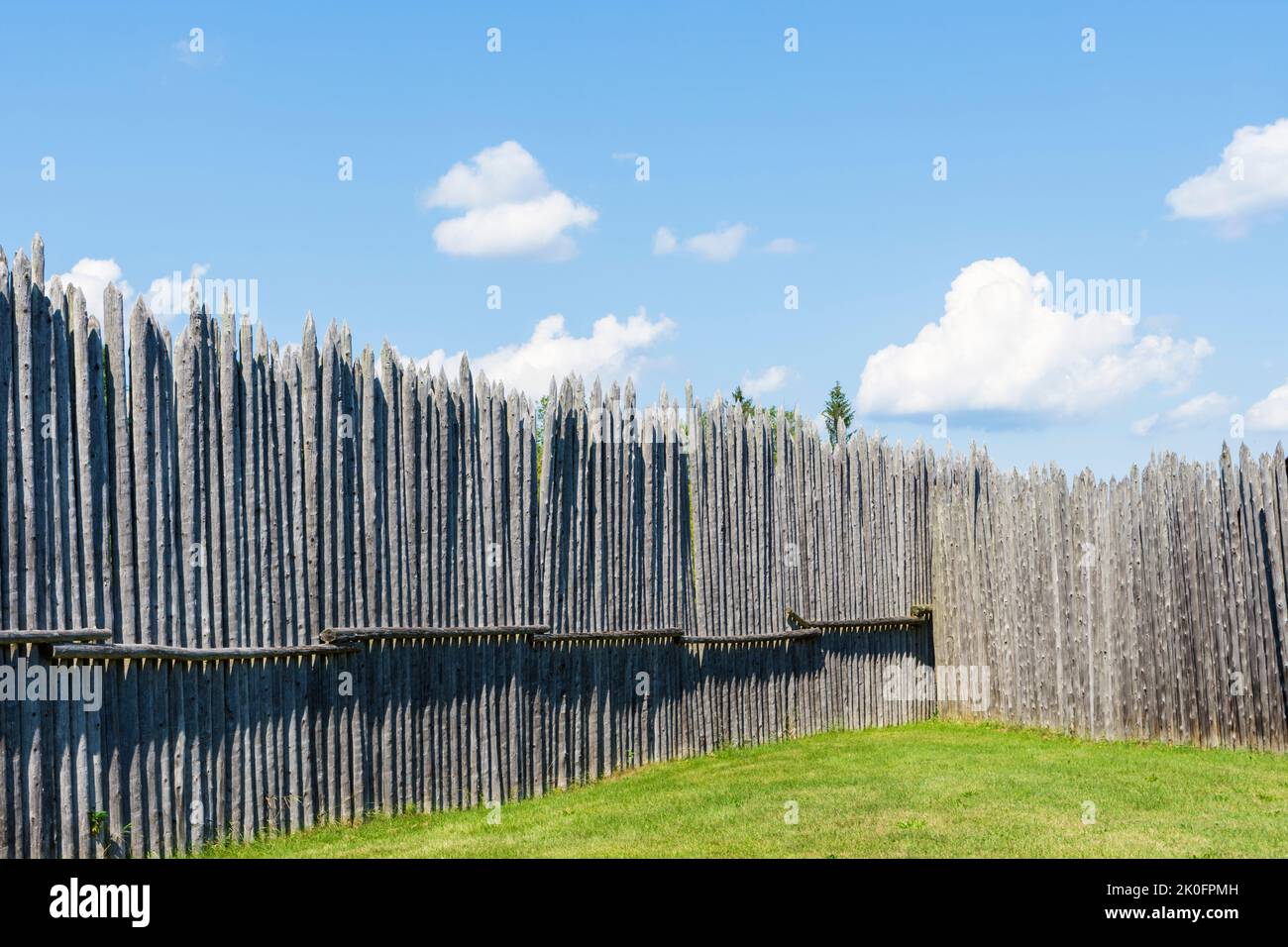 Reconstructed old fence with upright wooden poles at the Saint Marie Among the Hurons living museum, Midland, Ontario, Canada Stock Photo