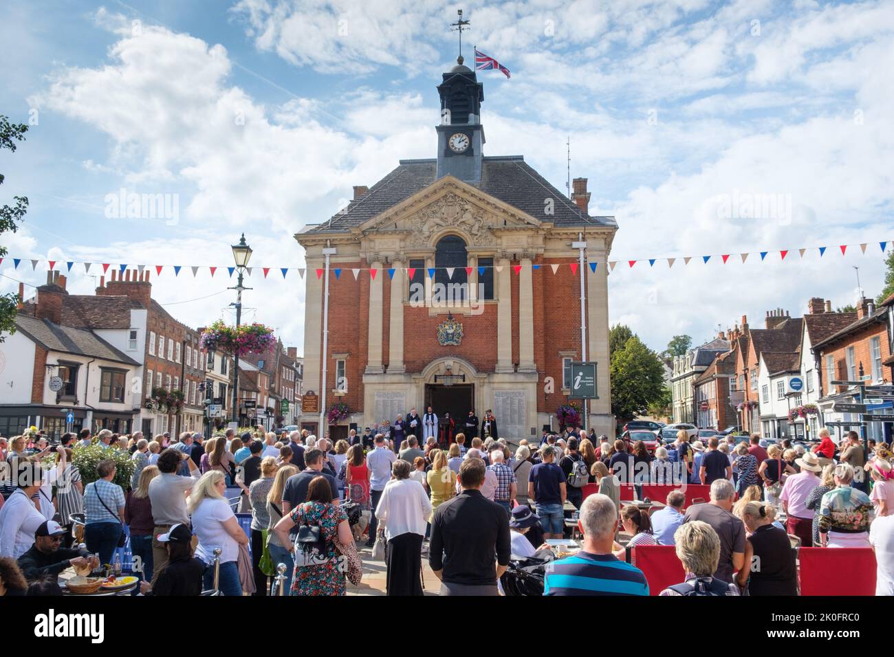 Residents of Henley-on-Thames gather in front of the Town Hall to hear the Proclamation Service for the Accession of King Charles III Stock Photo