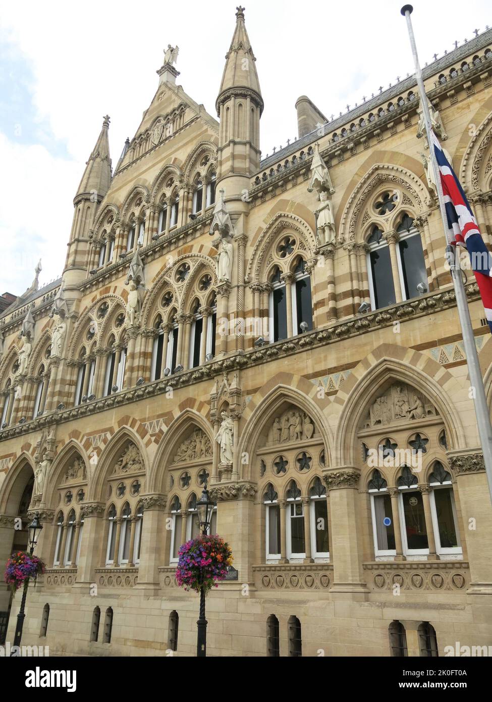 The Union Jack flag is flying at half-mast at the Guildhall in Northampton, the ornate civic building for the Town Council. Stock Photo