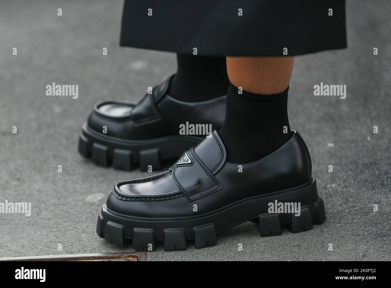 Milan, Italy - February, 24: Street style, woman wearing Prada shoes. Stock Photo