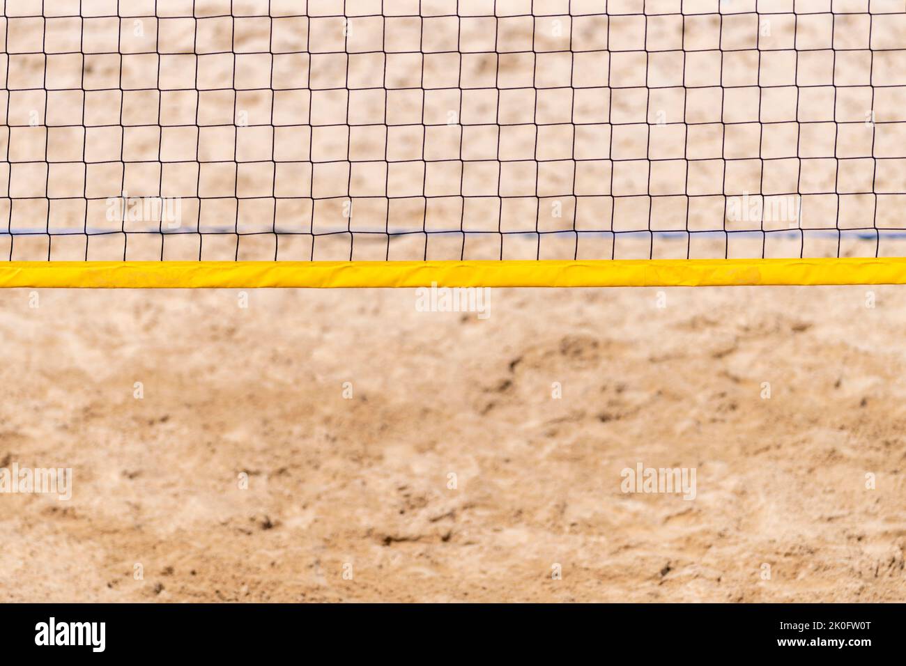 Beach volleyball and beach tennis net on the background of sand